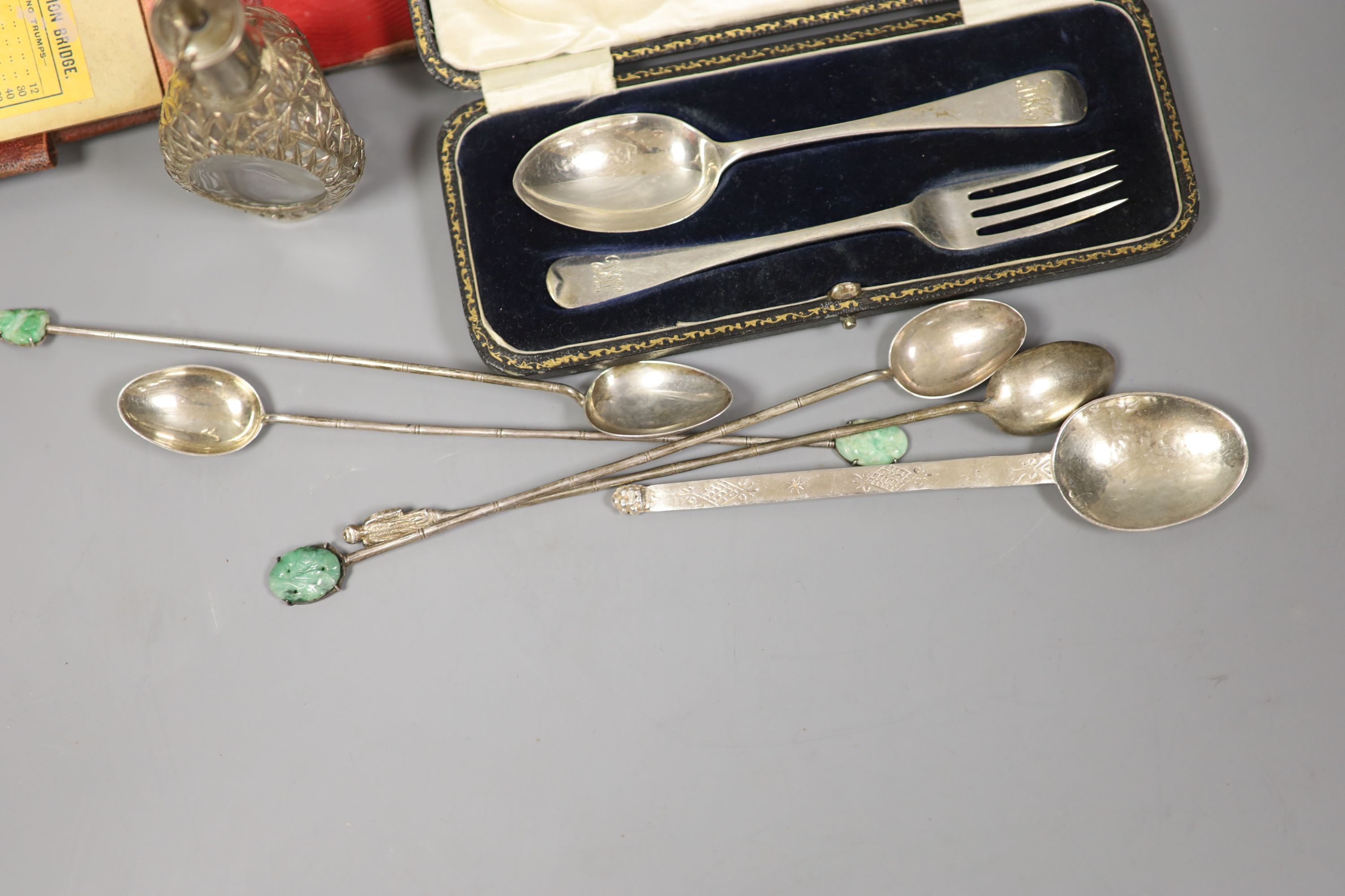 A modern silver spoon by Amy Sandheim (a.f.), a cased silver christening pair, a mounted bridge pad and Chinese cocktail spoons with jade terminals by Tack Hing, one other spoon and a similar scent bottle.